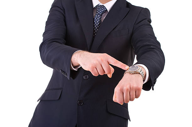 istock Businessman pointing at his wristwatch. 178851343
