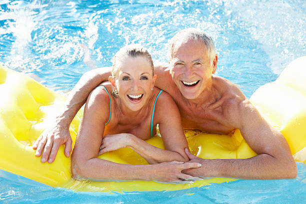 Senior couple having fun in pool