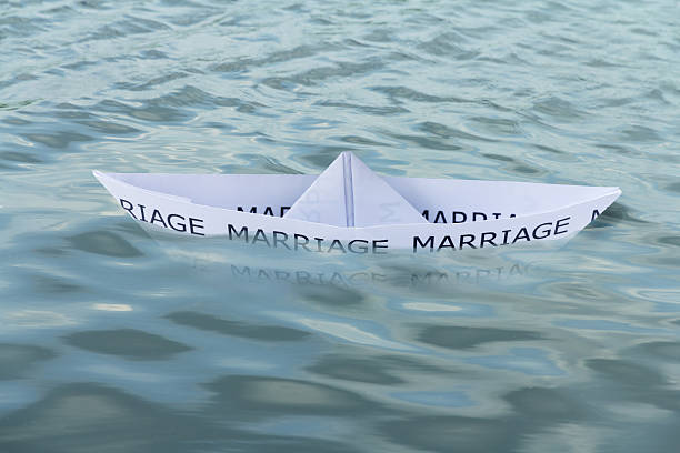 istock Paper boat Sinking Marriage 178852475