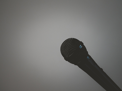 Microphone for speaking or singing karaoke music on a black background