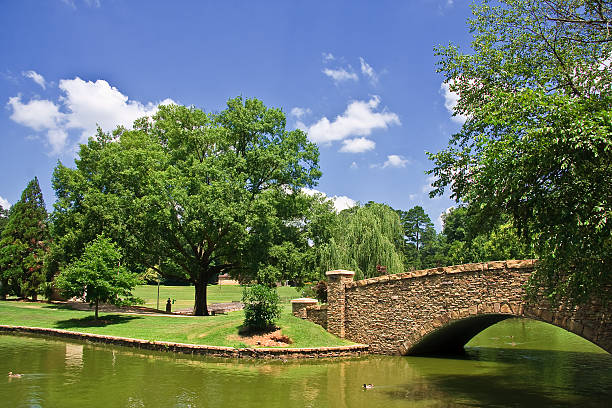 Retro-styled postcard of the Gapstow Bridge in New York City's Central Park. This was photographed on Kodachrome (with a diffusion filter) and there is a strong, natural grain throughout the image -- all artwork is my own...For hundreds of similar vintage postcards from around the world, click the banner below.
