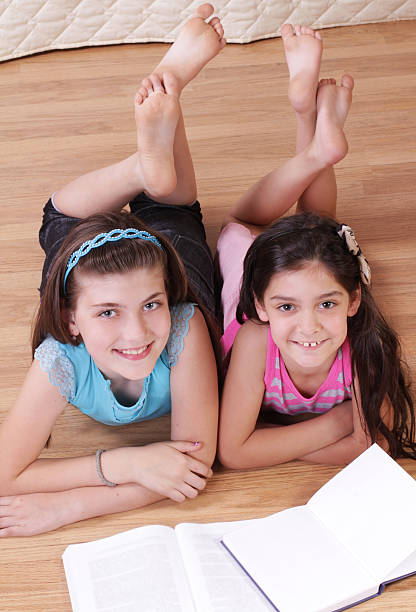 istock Cute little girls with books 178856421