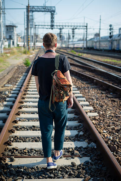 istock hipster modern stylish blonde man on rails 178856454