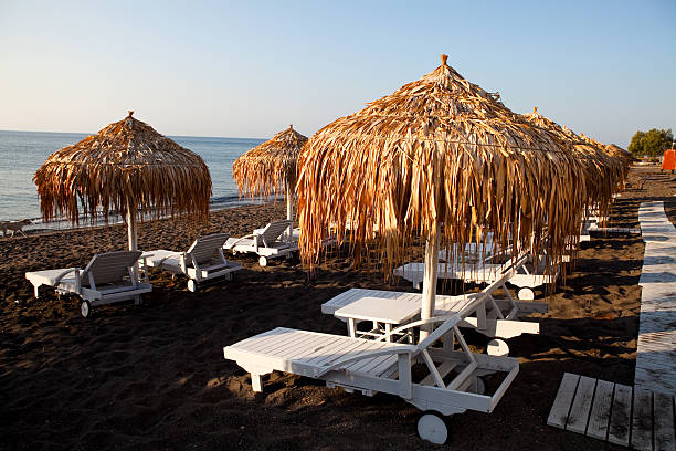 istock Sunbeds in Perissa, Santorini, Greece 178857472