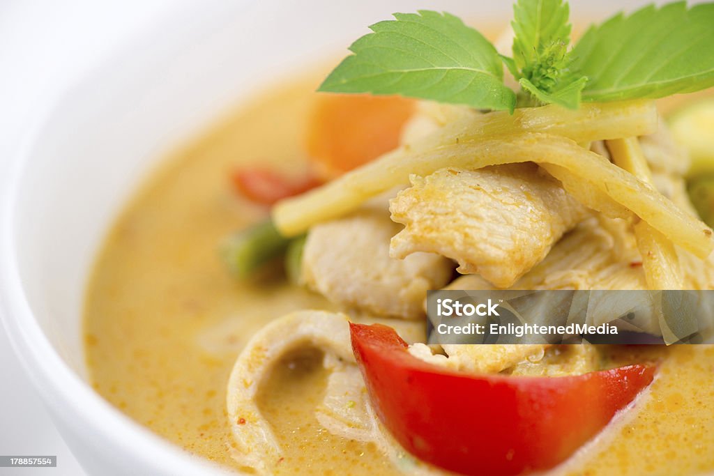Close-up of Thai chicken red curry with mixed vegetables Macro of garnished chicken red curry from Thailand with seasonal vegetables Asian Culture Stock Photo