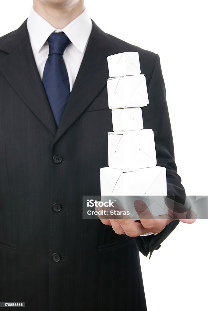 Pyramid of cubes Pyramid of cubes on hand of businessman. Isolated on white background. Achievement Stock Photo