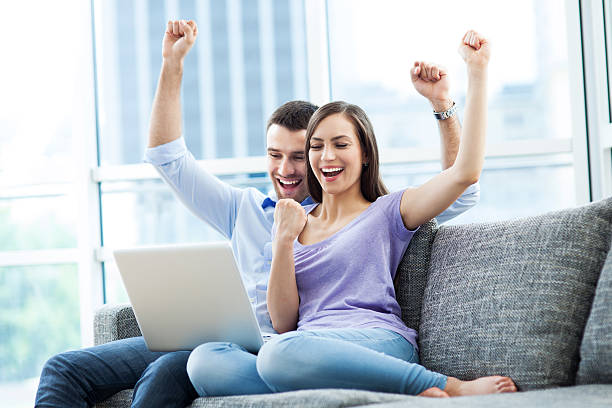 istock Couple on sofa with laptop 178858706