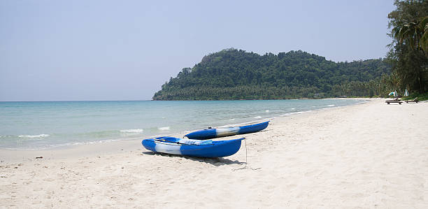 istock Two boats is on a tropical beach 178859828