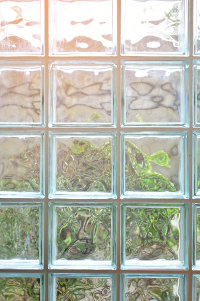 istock close up glass block wall with golden natural light background, interior design 1788599106