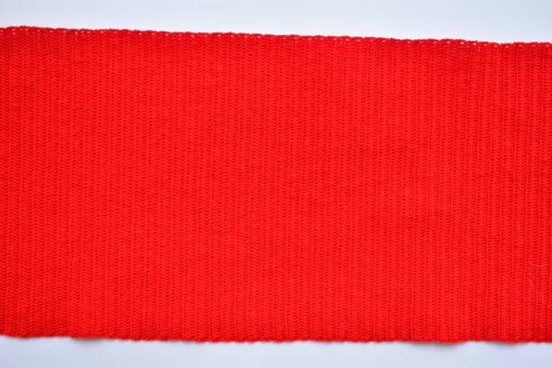 istock red wool knitted yarn texture, woolen fabric on white background 1788600831