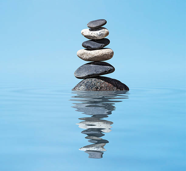 istock Zen balanced stones stack in lake  balance peace silence concept 178860630