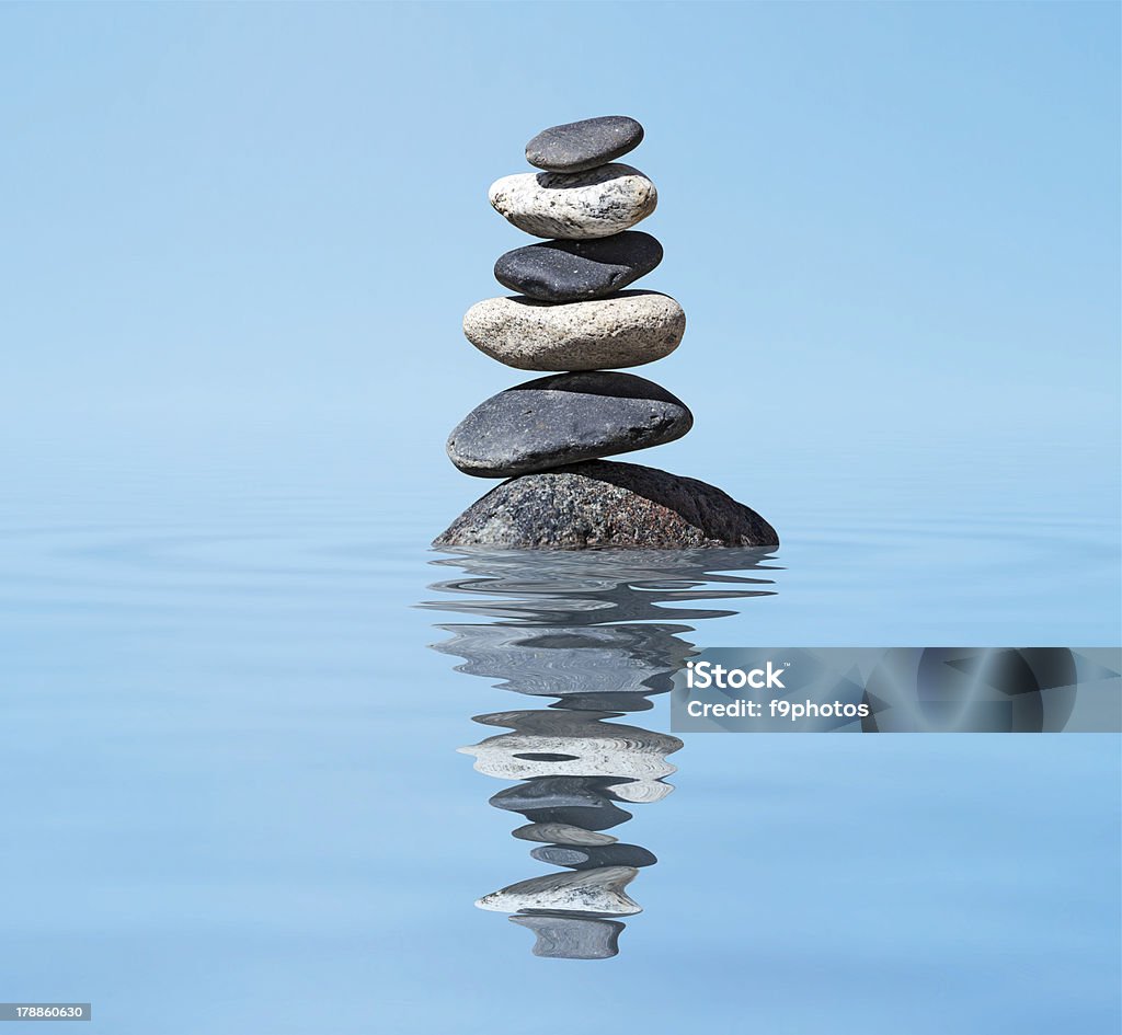 Zen balanced stones stack in lake  balance peace silence concept Zen meditation background -  balanced stones stack in water with reflection Balance Stock Photo