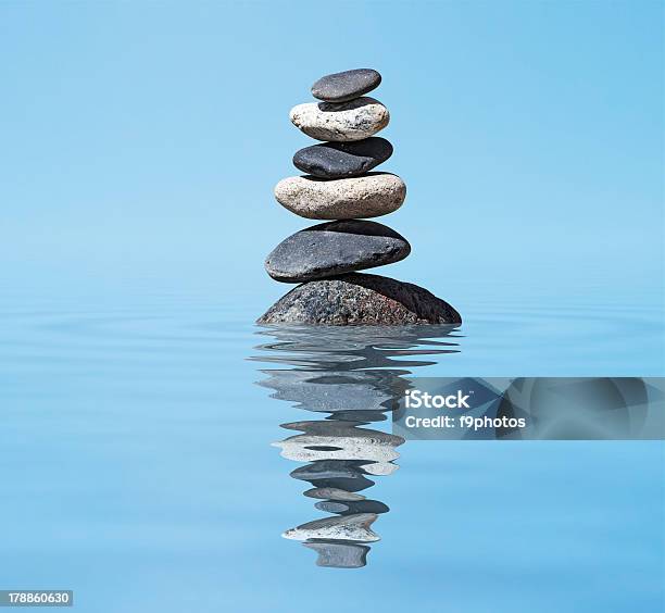 Zen Balanced Stones Stack In Lake Balance Peace Silence Concept Stock Photo - Download Image Now