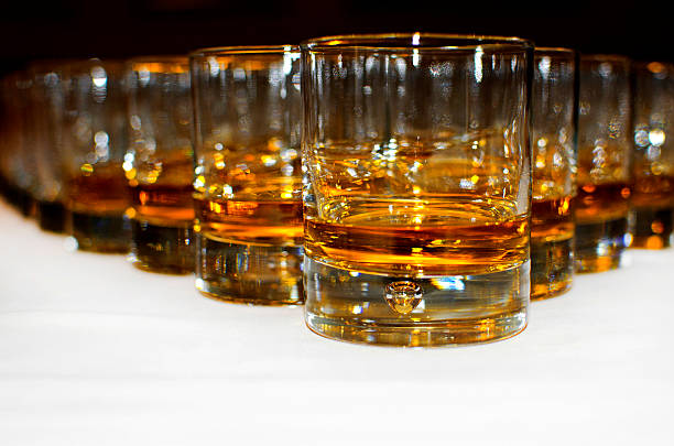 istock glasses of scotch whiskey on white table 178860705