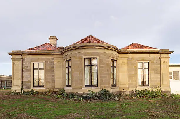 Generic Sandstone constructed building on large block of landhome