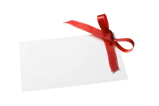 istock Blank gift tag tied with a bow of red ribbon 178861575