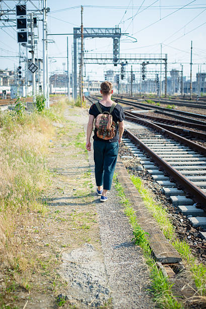 istock hipster modern stylish blonde man on rails 178861910