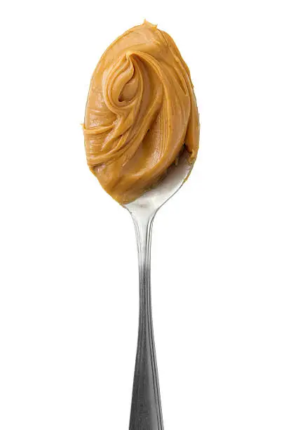 Creamy peanut butter in a spoon