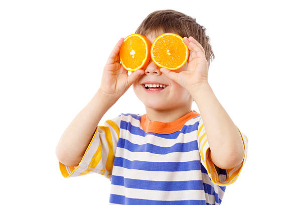 istock Funny boy with fruits on eyes 178862245