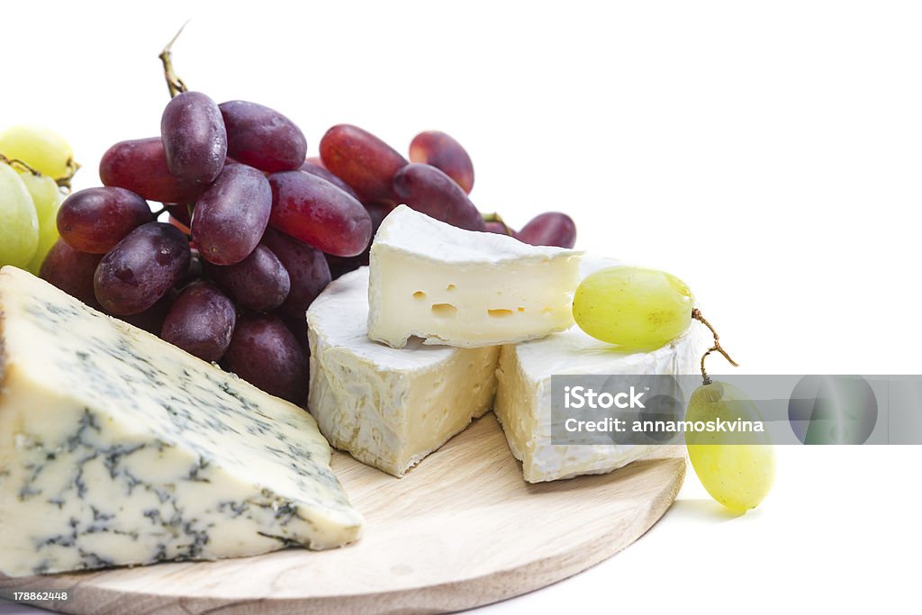 Cheese plate with grape Appetizer Stock Photo