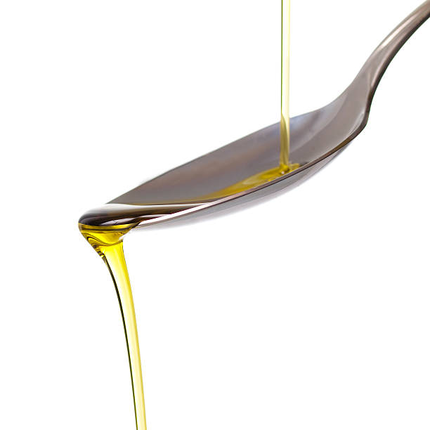 istock Olive oil pouring on a spoon 178863863