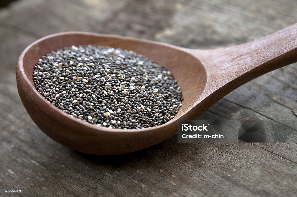 Nutritious chia seeds Nutritious chia seeds on a wooden spoon Antioxidant Stock Photo