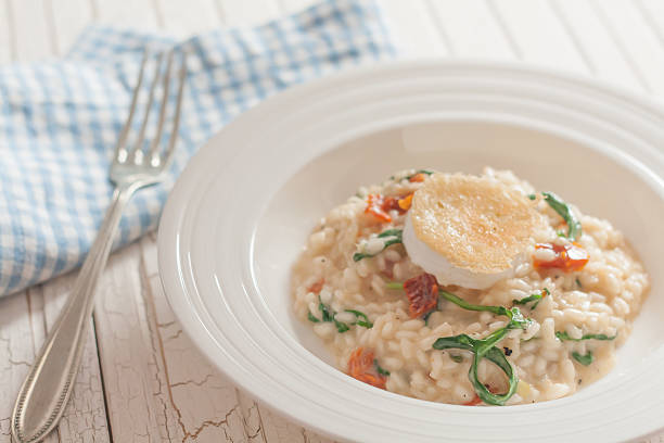 istock Risotto with Goat cheese, arugula and dried tomatoes 178864558