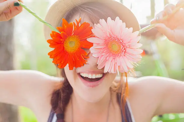 Photo of Young woman with flowers