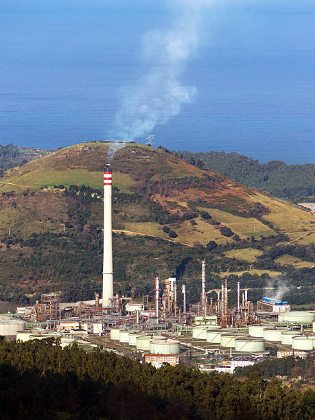 istock Refinery smokestack with smoke polluting environment 178867218