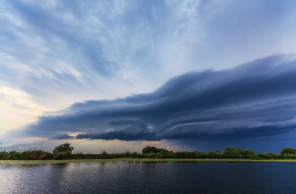istock Beautiful storm clouds over lake in spring 178867292
