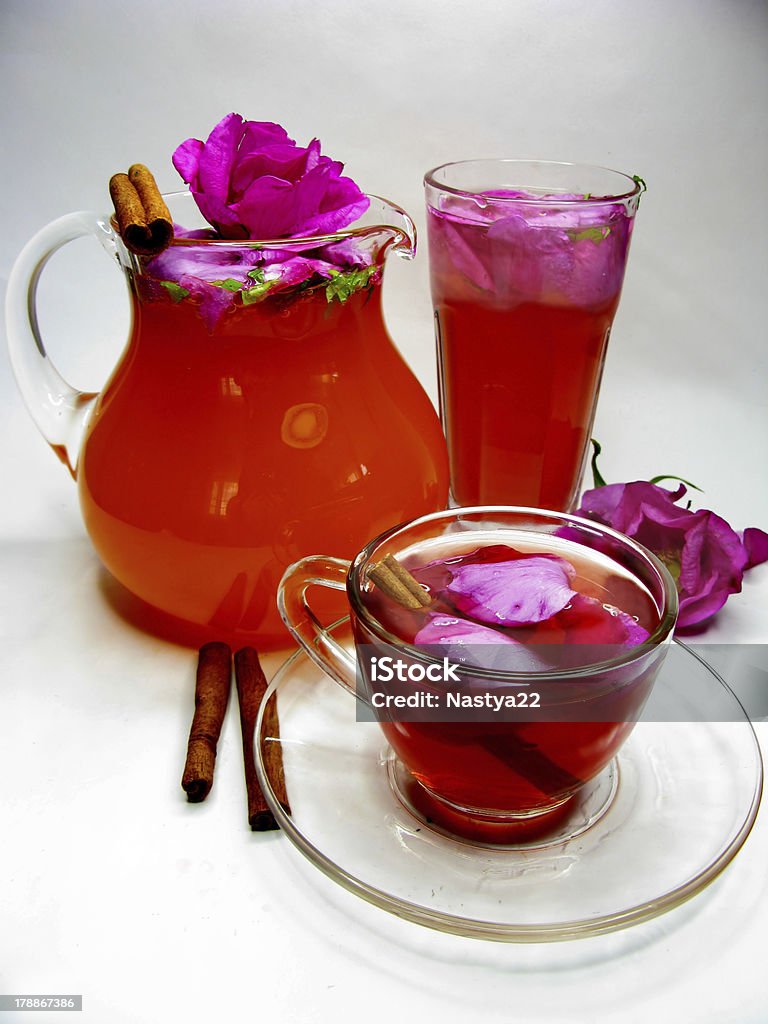 punch cocktail tea drink with wild rose rose punch tea cocktail punch in jug and cup Cinnamon Stock Photo