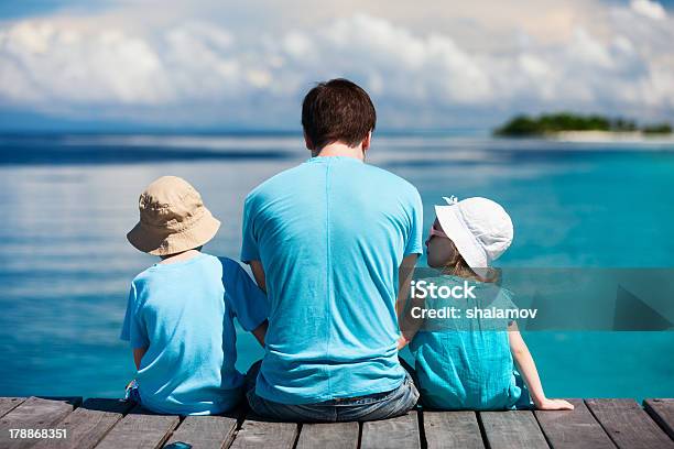 Father And Kids Enjoying Ocean View Stock Photo - Download Image Now - Adult, Boys, Brother