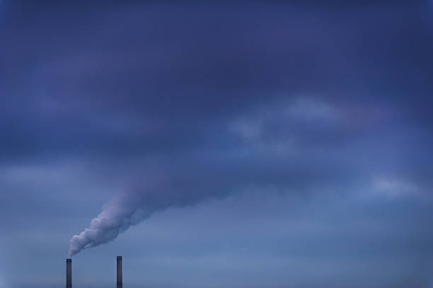 istock Heavy smoke spewed from coal powered plant 178868601