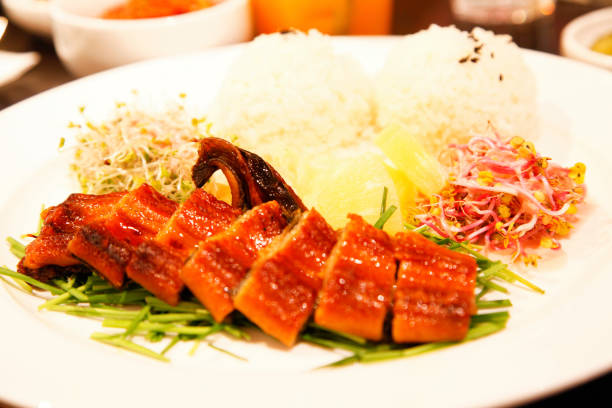 istock Grilled eel, Korean style, served with rice and vegetables. Selective focus, Close up. 1788691939