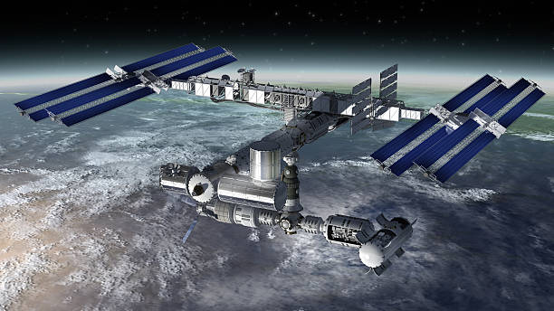 istock Orbiting international space station seen over cloudy earth 178870030