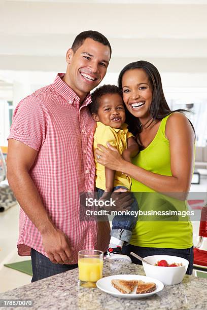 Family Having Breakfast In Kitchen Together Stock Photo - Download Image Now - Family, African-American Ethnicity, Pregnant