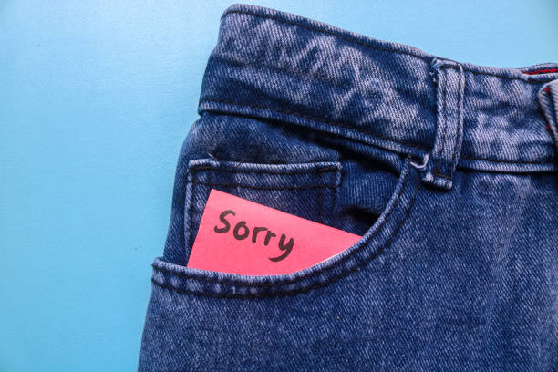 istock The word sorry is written on a red sticky note in a jeans pocket on a blue background. Apologizing Concept 1788702837