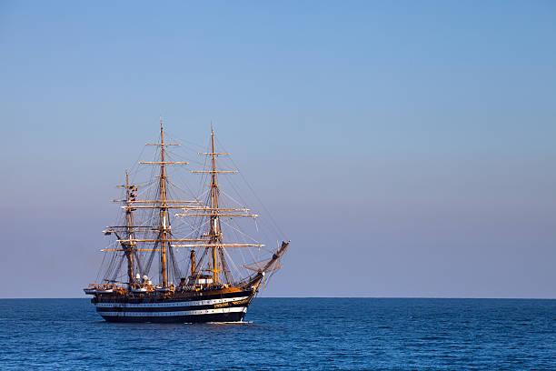 Three-masted sailboat in the sea stock photo