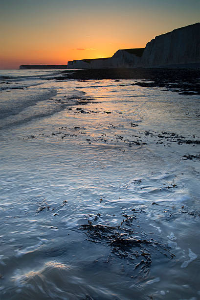 istock Long exposure landscape rocky shoreline at sunset 178871289