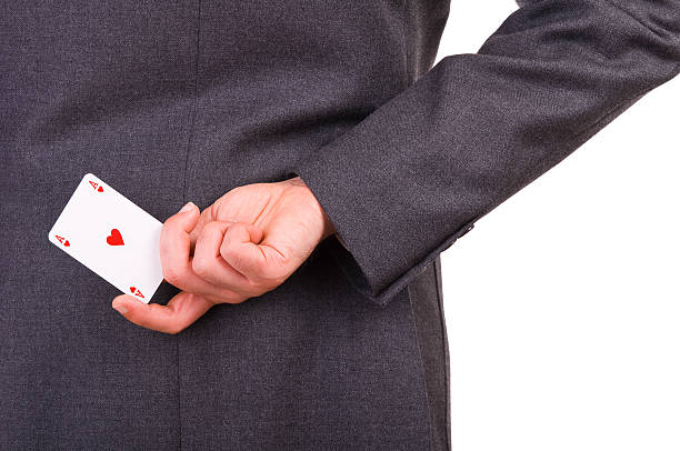 istock Businessman holding playing card behind his back. 178871335