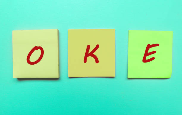 istock Okay writing on sticky note isolated on blue background.Okay on empty Space sticky note theme 1788715845