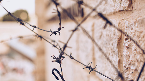 Barbed wire on an ancient wall in Jerusalem
