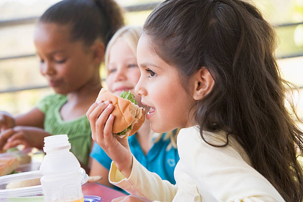istock Children eating sandwiches in kindergarten 178872330