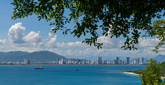The sea bay and the Vietnamese city of Nha Trang on a sunny cloudy day