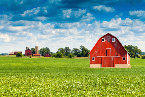 Traditional American Red Barn With Blue Sky