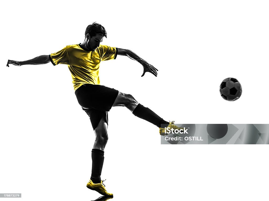 ブラジルのサッカー選手若い男性の足蹴りシルエット - サッカー選手のロイヤリティフリーストックフォト