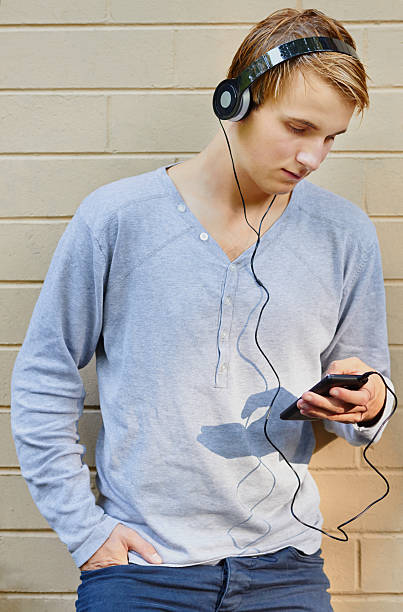 istock Young male going through song list 178873423