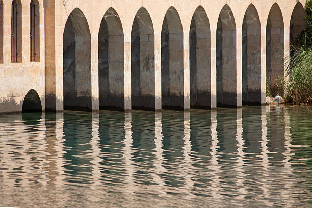 mosque architecture reflected at water at halfeti turkey