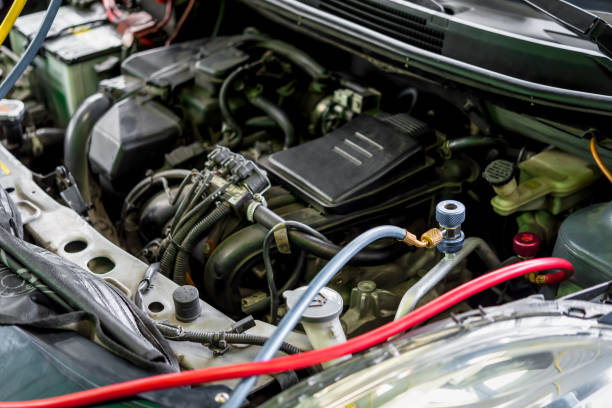 istock Car refilling air condition at car garage 1788741801
