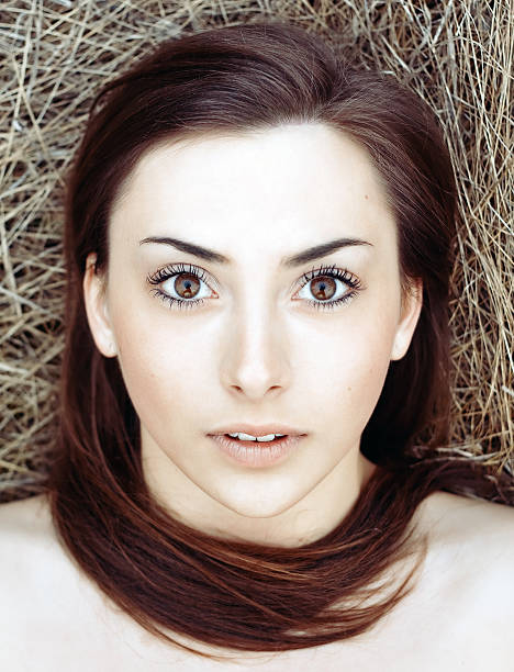 Outdoor closeup portrait of young beautiful brunette stock photo